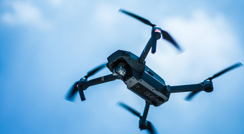 photo of gray quadcopter on the sky