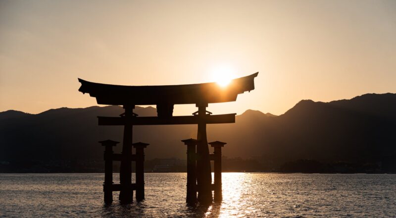 a silhouette of the itsukushima shrine in japan