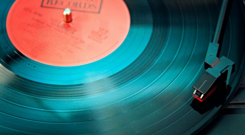 blue vinyl record playing on turntable