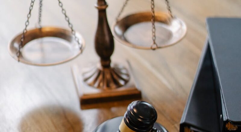 judges desk with gavel and scales